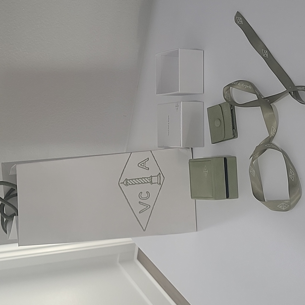 Van cleef packaging with ribbon and travel pouch